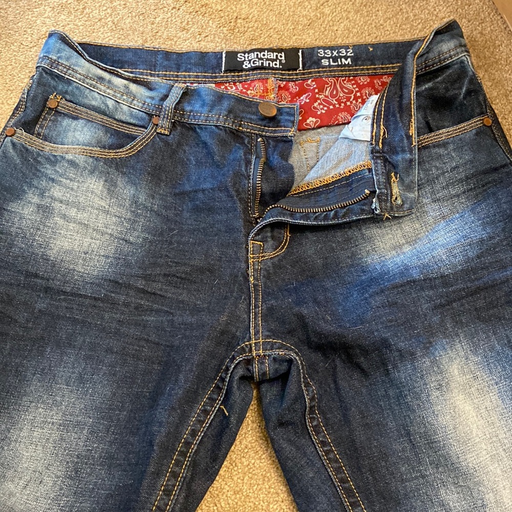 Dark blue, faded jeans